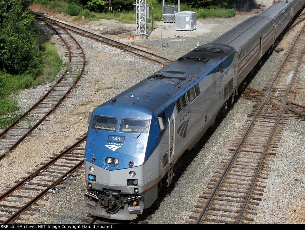 AMTK 144 leads train 80 across the diamonds at Boylan